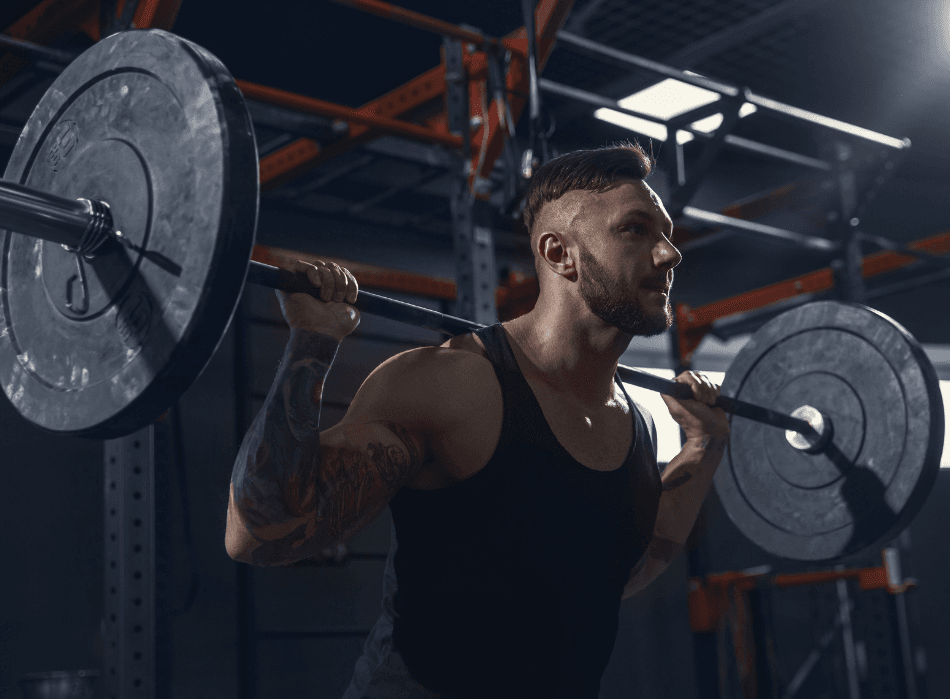 Athlete performing a barbell back squat in a Bangkok gym — use our calorie calculator to plan the nutrition behind training like this