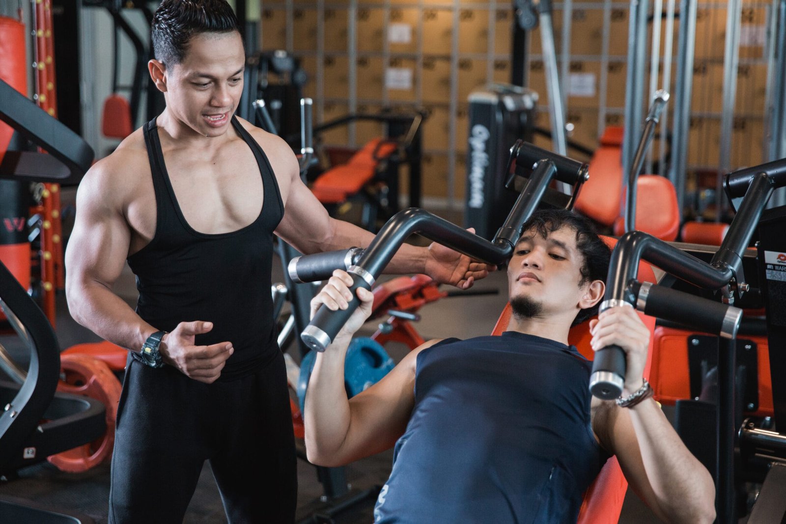 Client performing chest exercises with a trainer