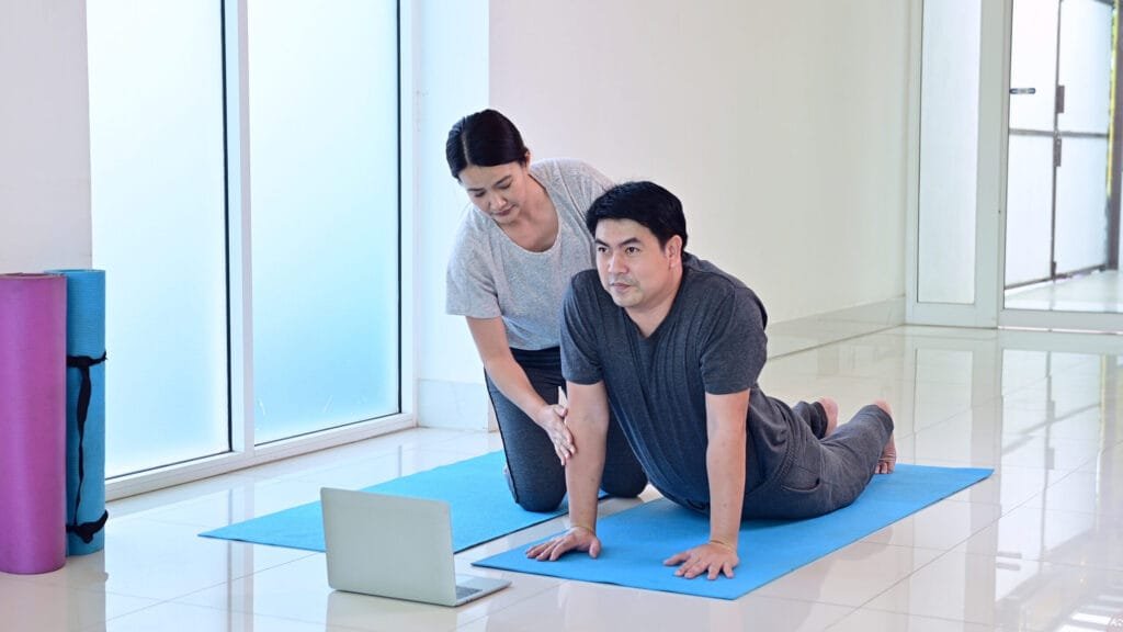 Couple doing an online training session at home