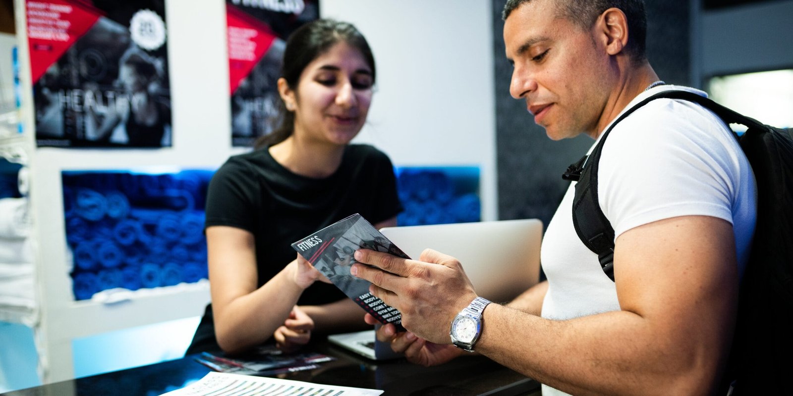 Client discussing a training package at reception