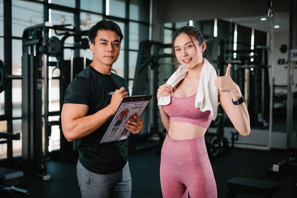Client reviewing her training schedule with a coach