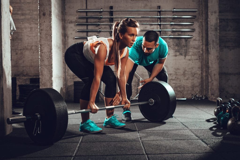 Woman training hard with her coach